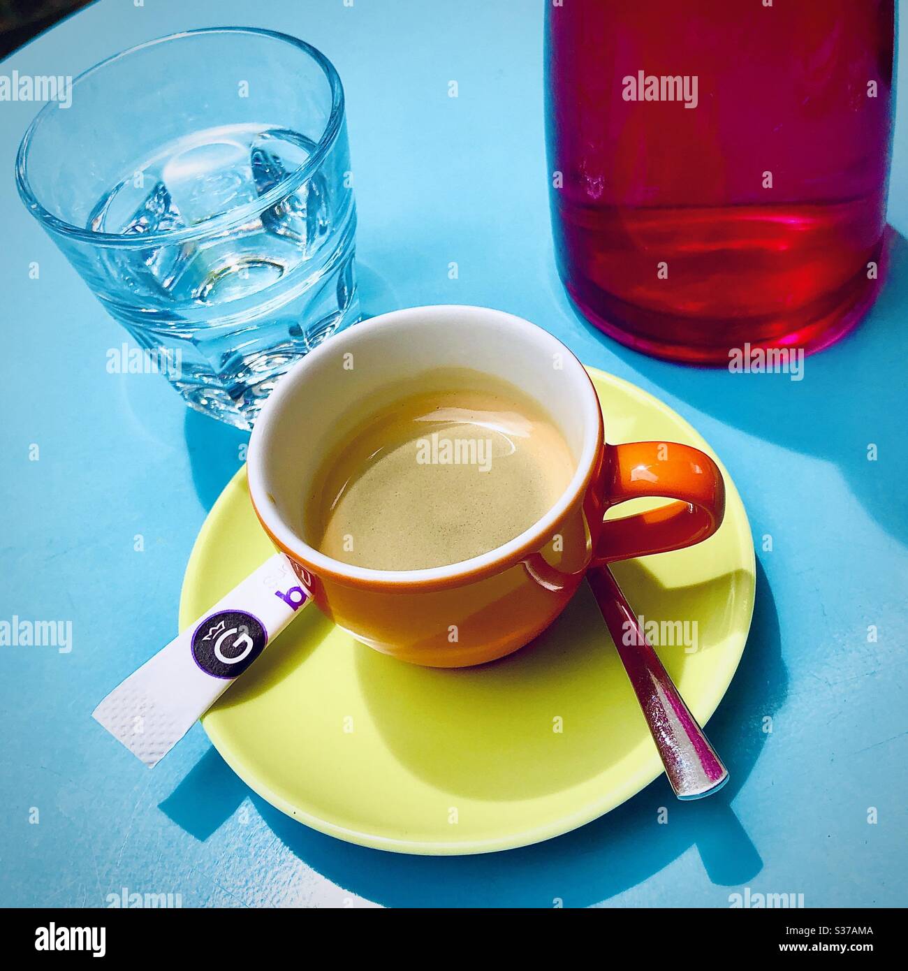 Colourful cafe table and coffee cup. Stock Photo