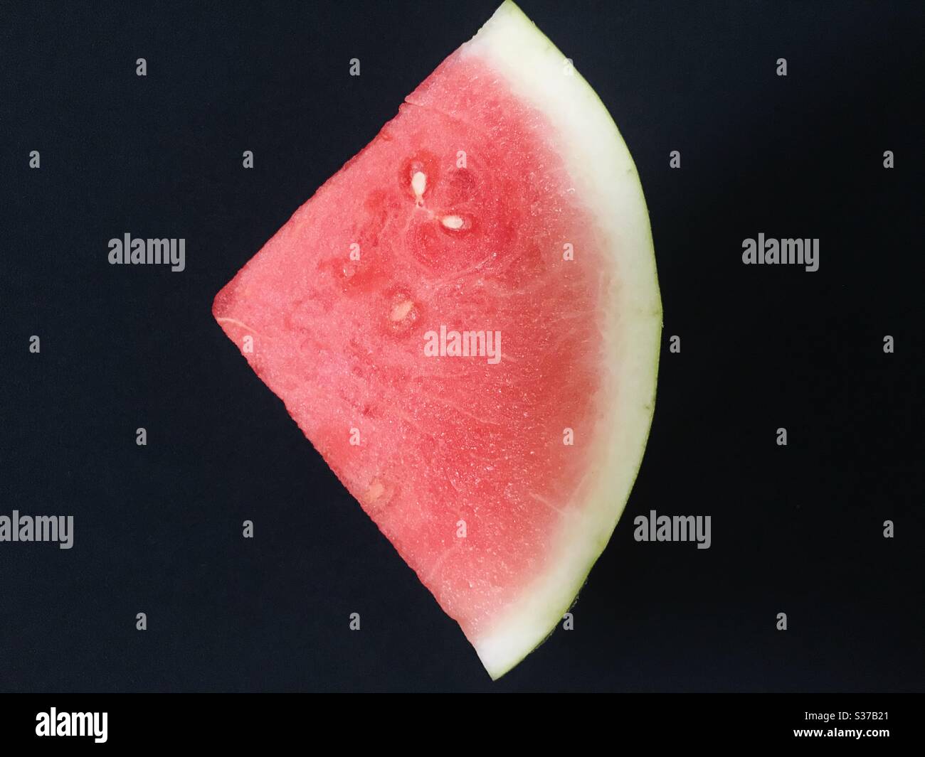 Freshly sliced watermelon on black background , Ready to eat summer treat! Stock Photo