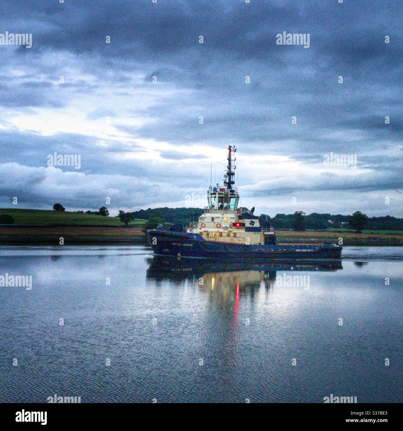 Tug pulling Azamara Quest up the River Clyde. - Smartphone Captured Stock Image