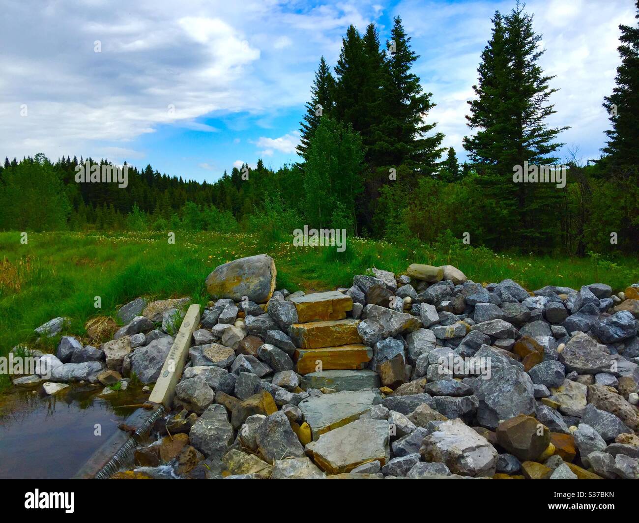 Visit Bragg Creek, Alberta, Canada, dam, pond, creek, stream, mountains, mirror, reflection, wilderness, scenic, water, land, hills, sky. - Smartphone Captured Stock Image