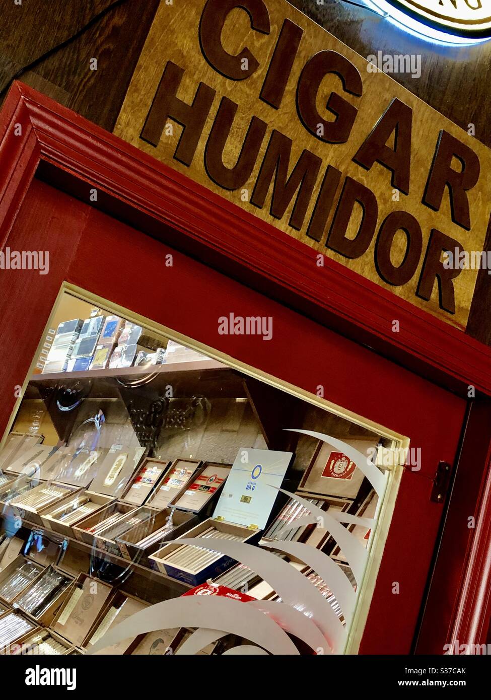 Cigar Humidor sign at entrance to the humidor shop contains various