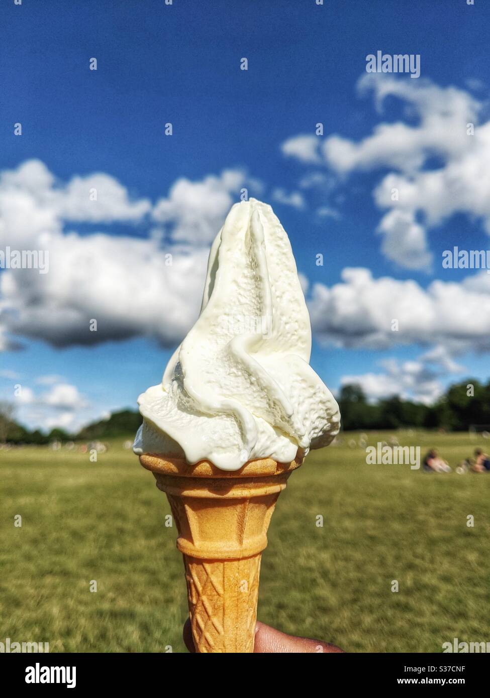 Softie Ice cream cone with blue sky background on sunny day Stock Photo
