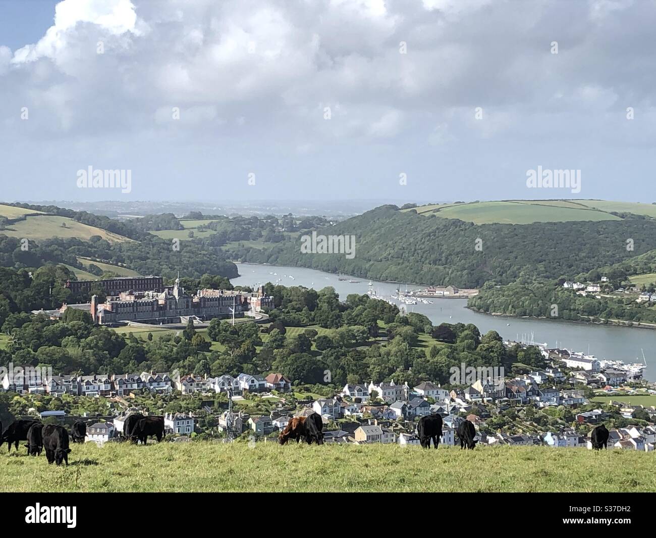 Looking over Dartmouth & up the River Dart from Jawbones with the  Britannia Royal Naval College (BRNC), it is the naval academy of the United Kingdom and the initial officer training establishment. - Smartphone Captured Stock Image