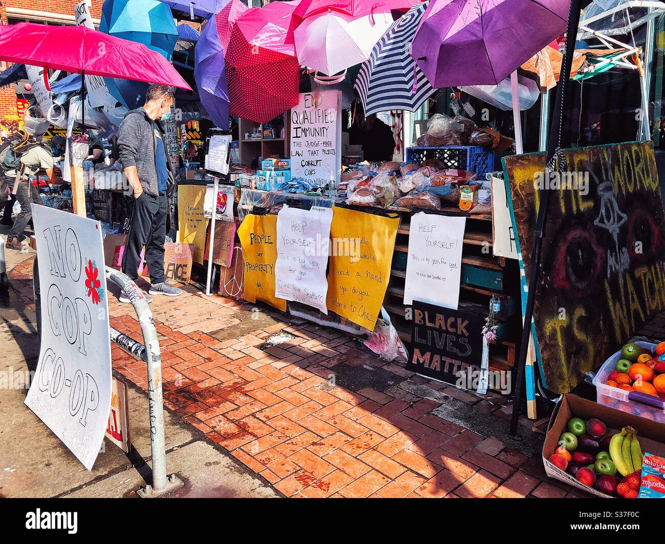 No cop co-op street market in CHAZ CHOP autonomous zone on Capitol Hill in Seattle - Smartphone Captured Stock Image