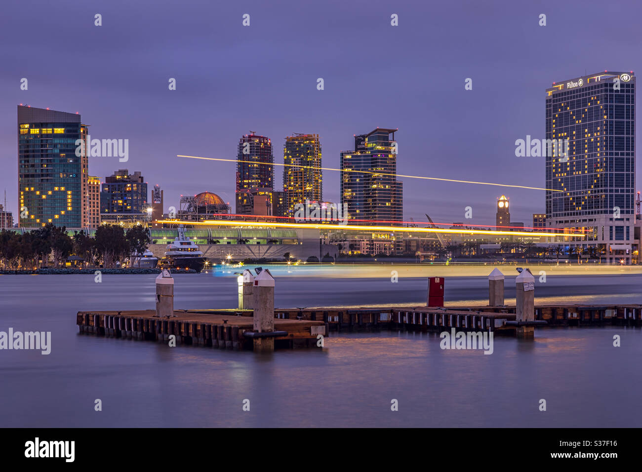 San Diego, California- June 19, 2020: The downtown skyline seen across the bay. The Hilton San Diego Bayfront Hotel has lit up its windows in support of Black Lives Matter. Stock Photo