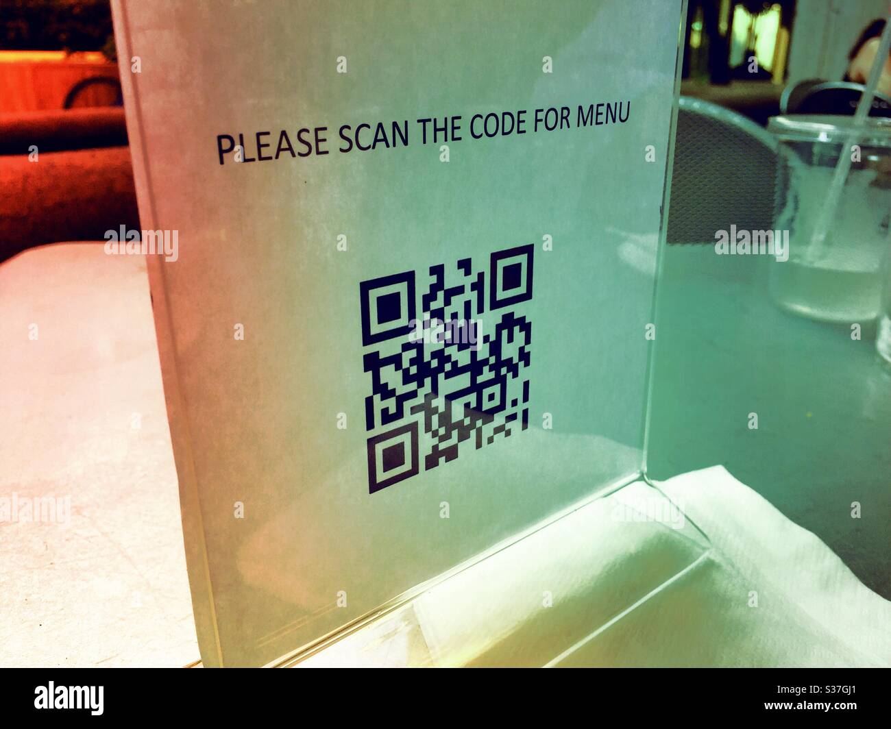 Scanning code access to menus is part of the contactless procedures employed in New York City during the phase re-opening caused by the pandemic coronavirus, June 2020, New York City, United States - Smartphone Captured Stock Image