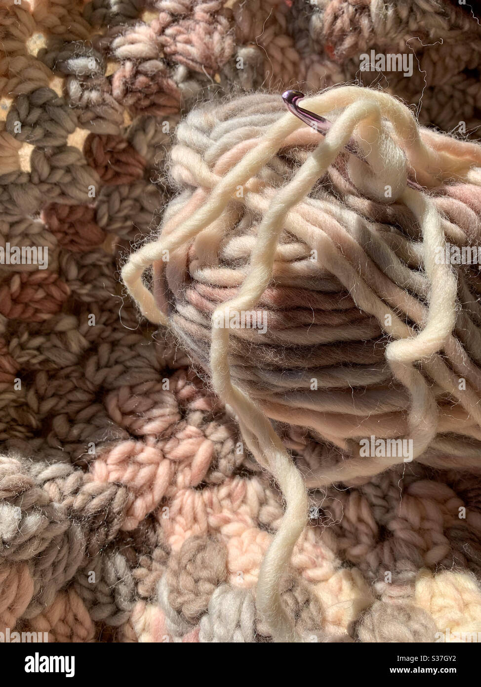 Crochet square and wool and crochet hook - Smartphone Captured Stock Image