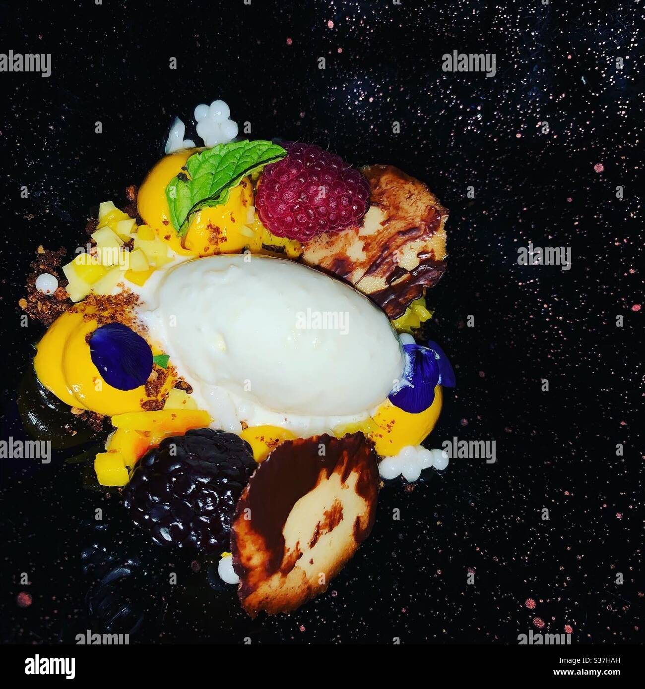 Mango cheesecake course at 5.8 undersea restaurant Maldives Stock Photo