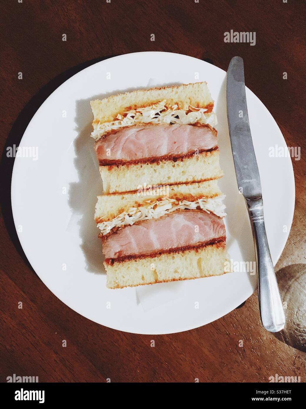 Katsu sando sandwich with cutlery Stock Photo