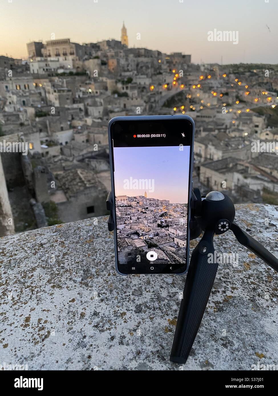 Smartphone on a tripod for a beautiful timelapse session of Matera, Unesco site, Italy Stock Photo