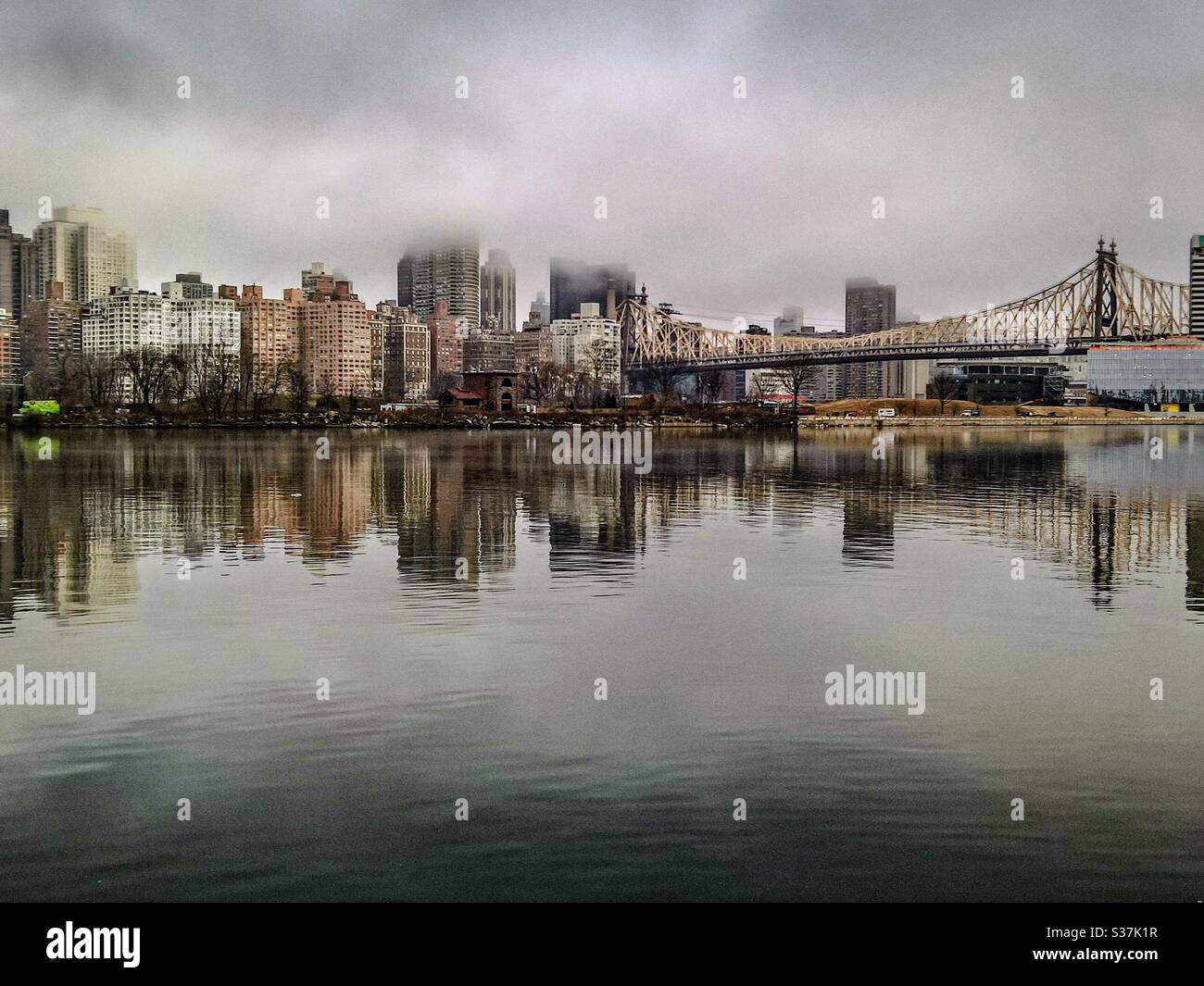 Queensboro Bridge and Midtown Manhattan on a foggy day Stock Photo