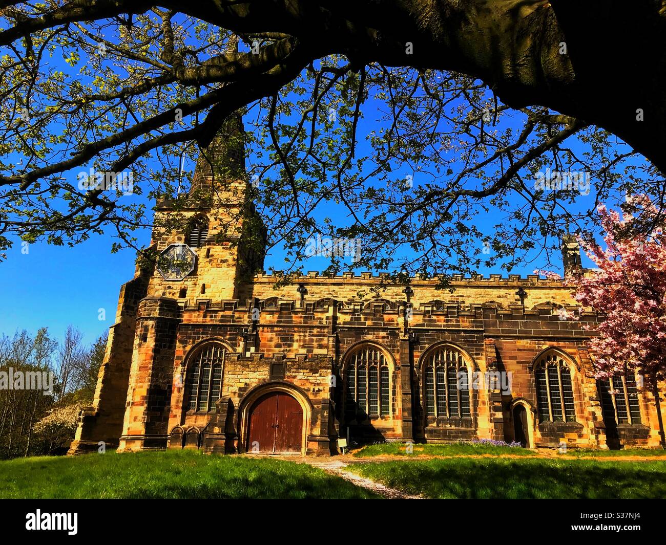 Picture of Saint Oswald’s church in Winwick Cheshire on a lovely spring day April 19th 2020 in lockdown. Stock Photo