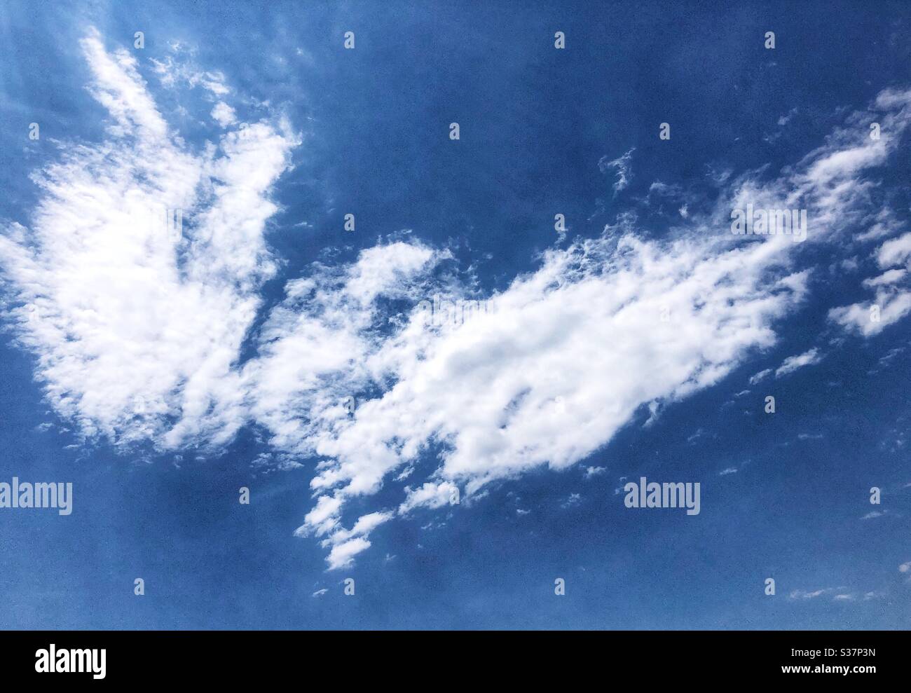 Angel wings cloud formation in the sky. Stock Photo