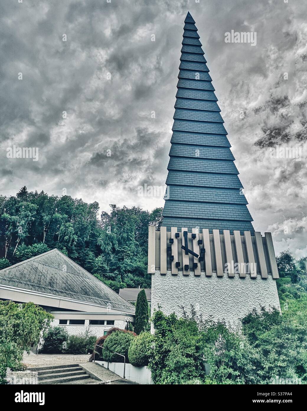 Quirky 1960s Swiss church with pointy spire - Smartphone Captured Stock Image