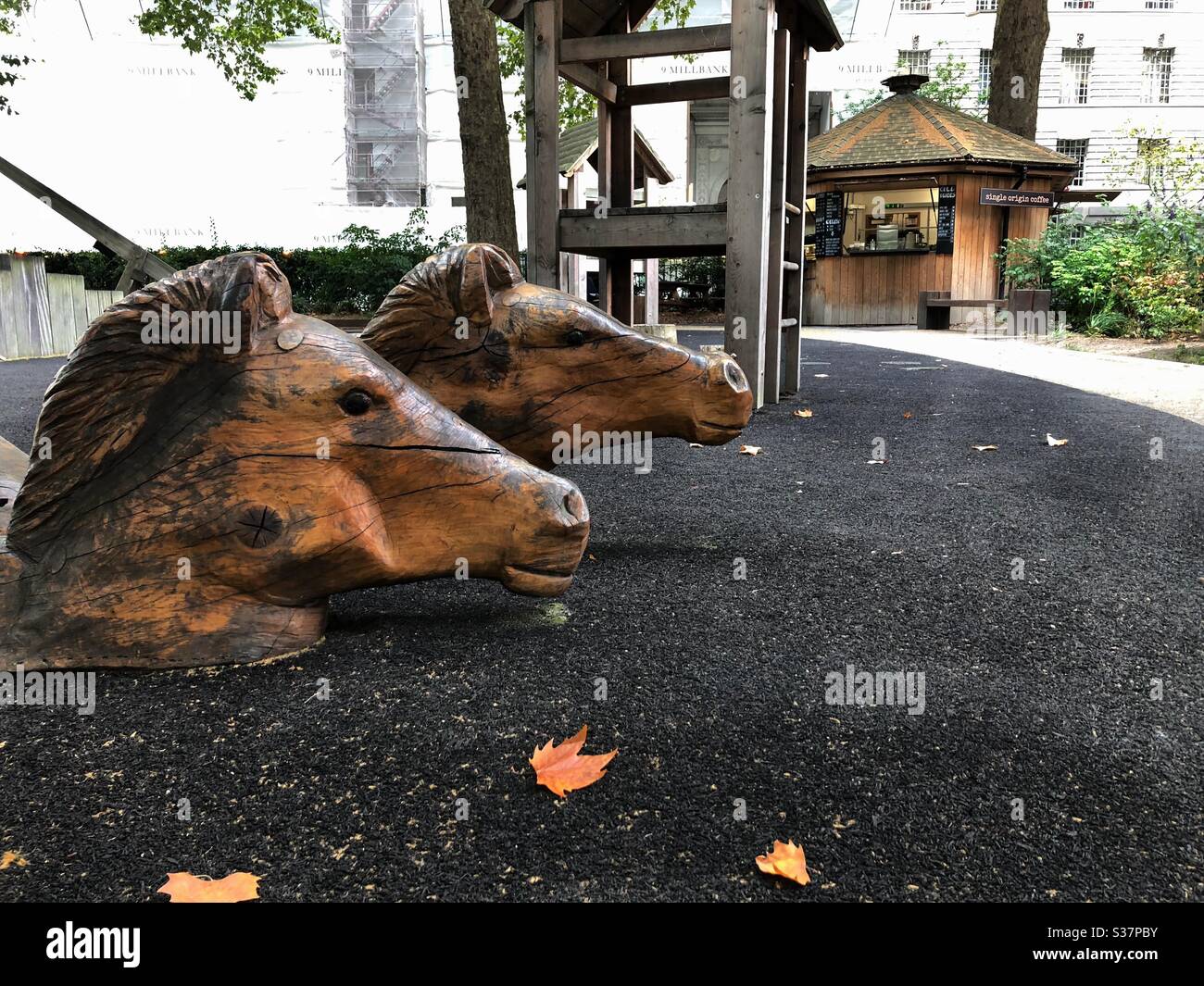 Wooden horse heads in play area of Victoria Tower Gardens in Westminster, London Stock Photo