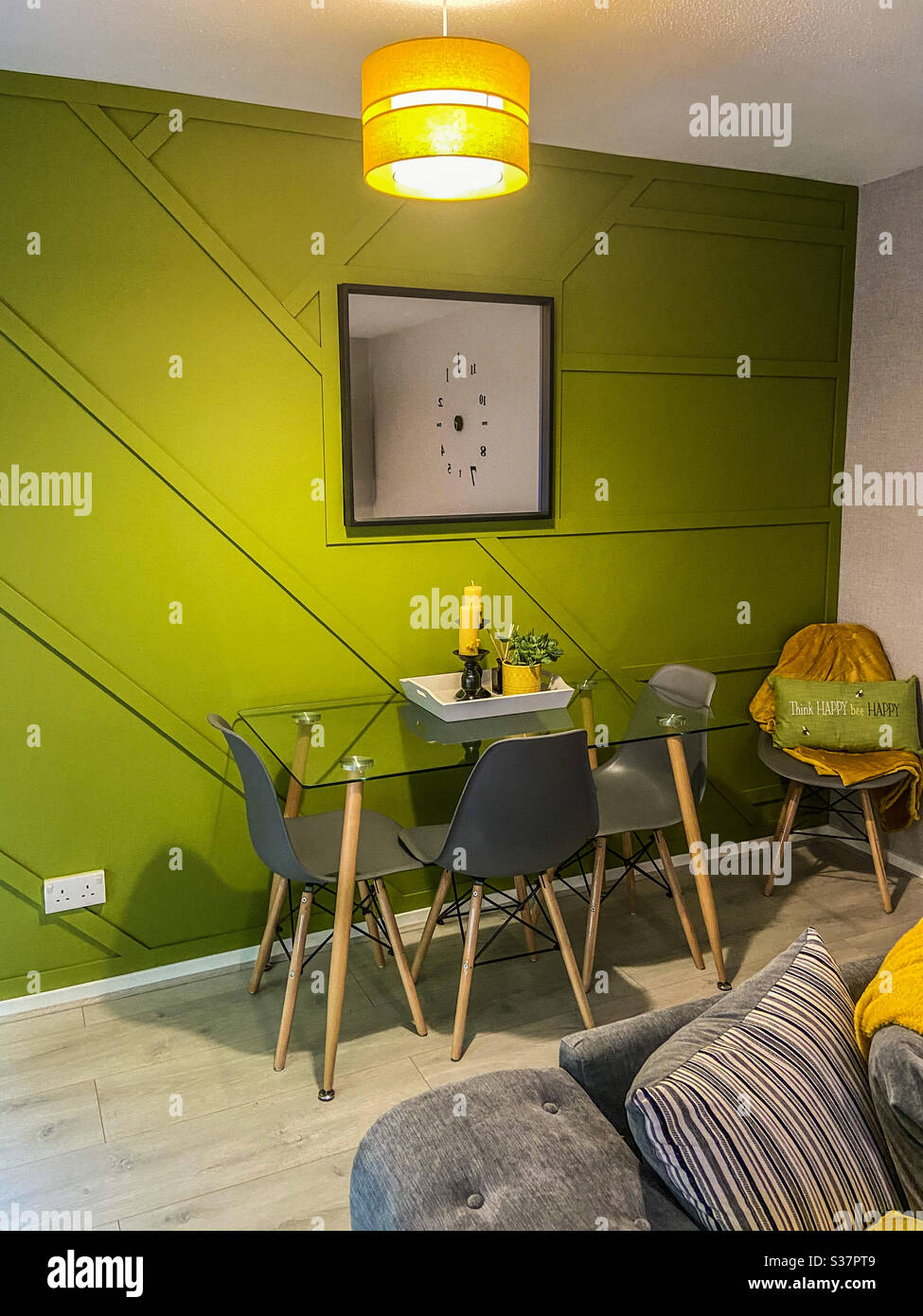 Modern green and yellow living room with panelling Stock Photo Alamy