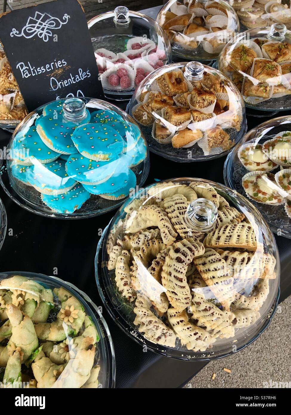 Display of Middle Eastern cakes at the Arab market in Châtellerault, Vienne (86), France. Stock Photo