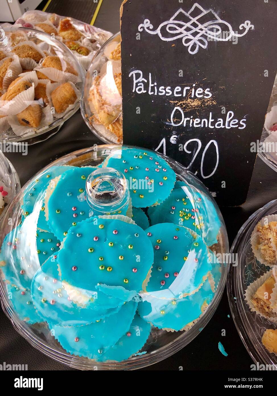 Display of Oriental baklava cakes at Châtellerault market, Vienne (86), France. - Smartphone Captured Stock Image