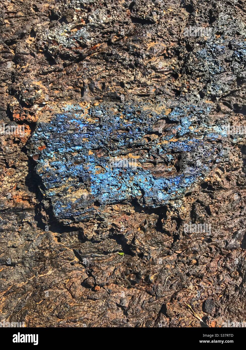 Cooled lava rock called Blue Dragon in the Craters of the Moon National Monument in Idaho.  Sometimes called Basalt or Obsidian. - Smartphone Captured Stock Image