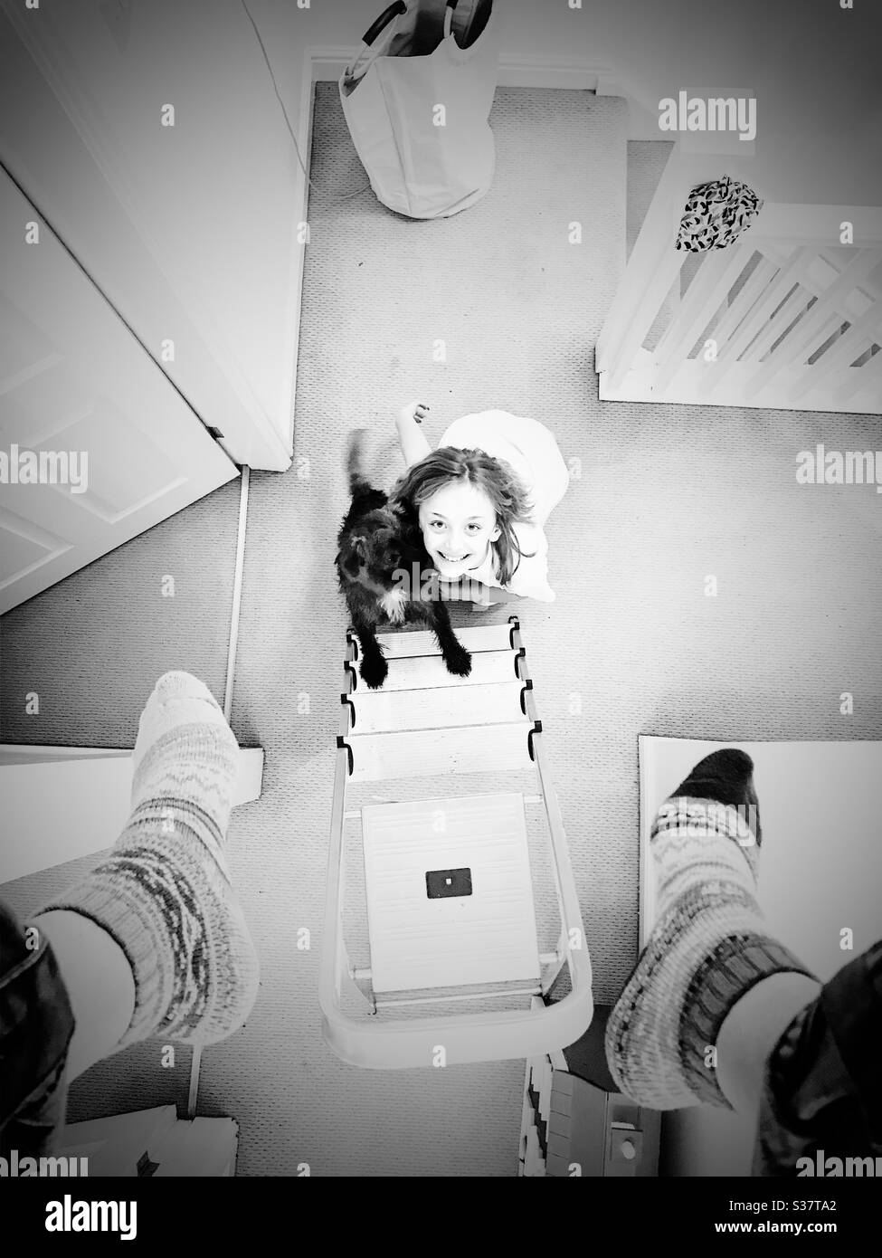 Looking down from an attic. Family life Stock Photo
