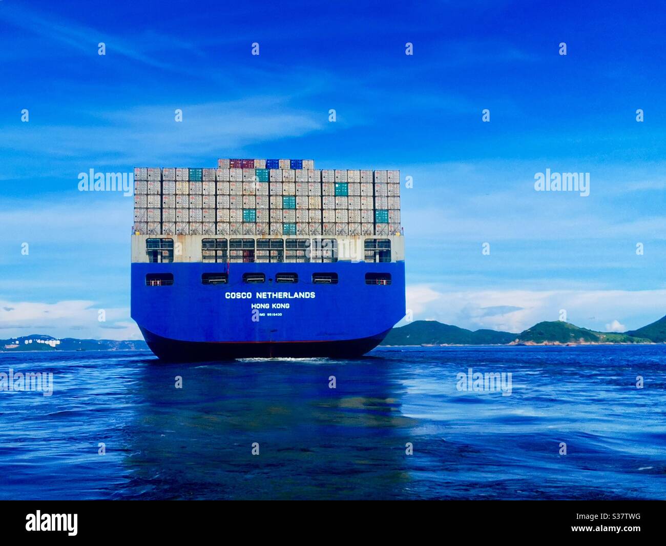 Cosco Netherlands Hong Kong container ship crossing the east Lamma Channel in Hong Kong. - Smartphone Captured Stock Image
