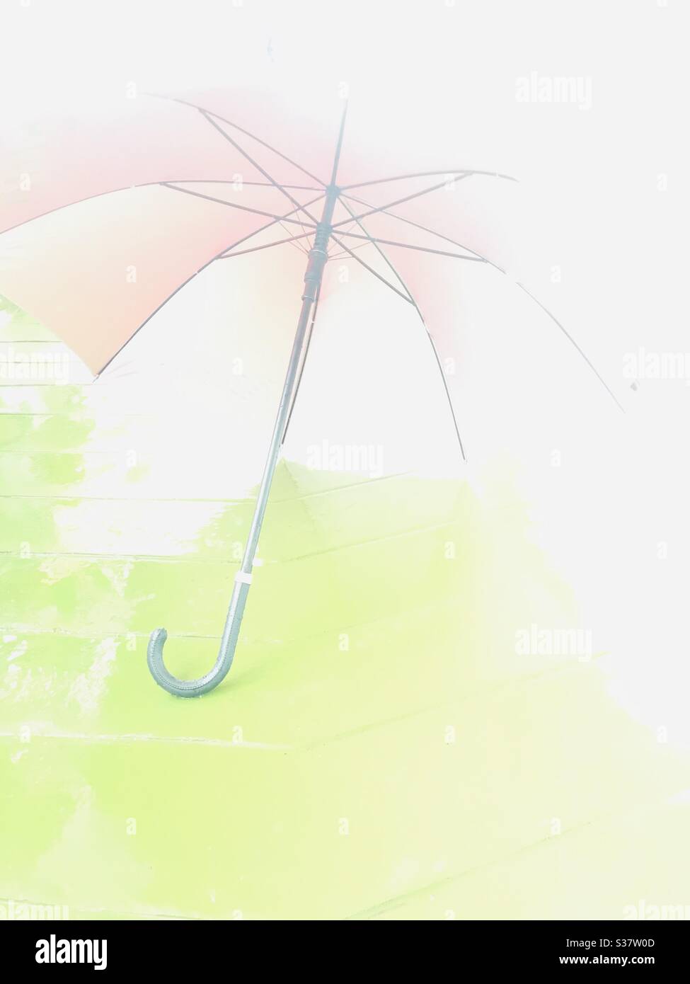 Edited image -of a wet umbrella on a rainy day Stock Photo