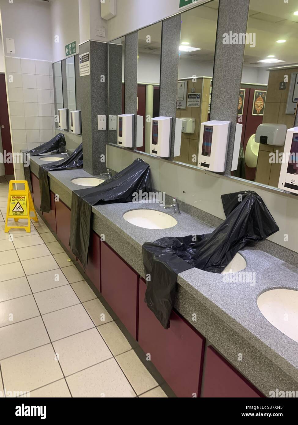 News, following safe distancing in publick toilets. UK Stock Photo Alamy