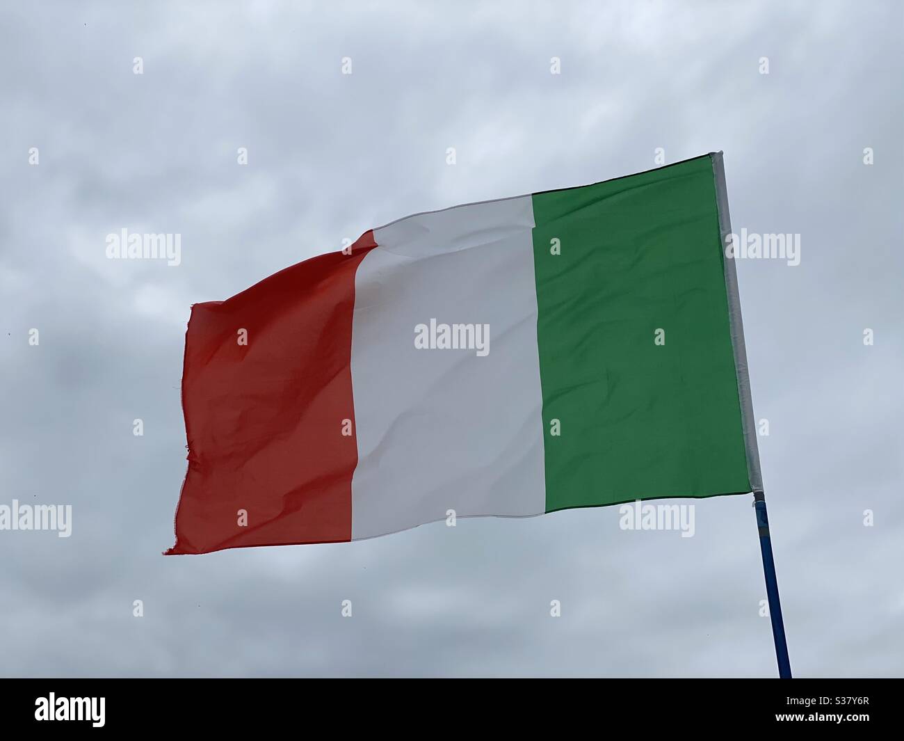 Italian flag in cloudy weather Stock Photo