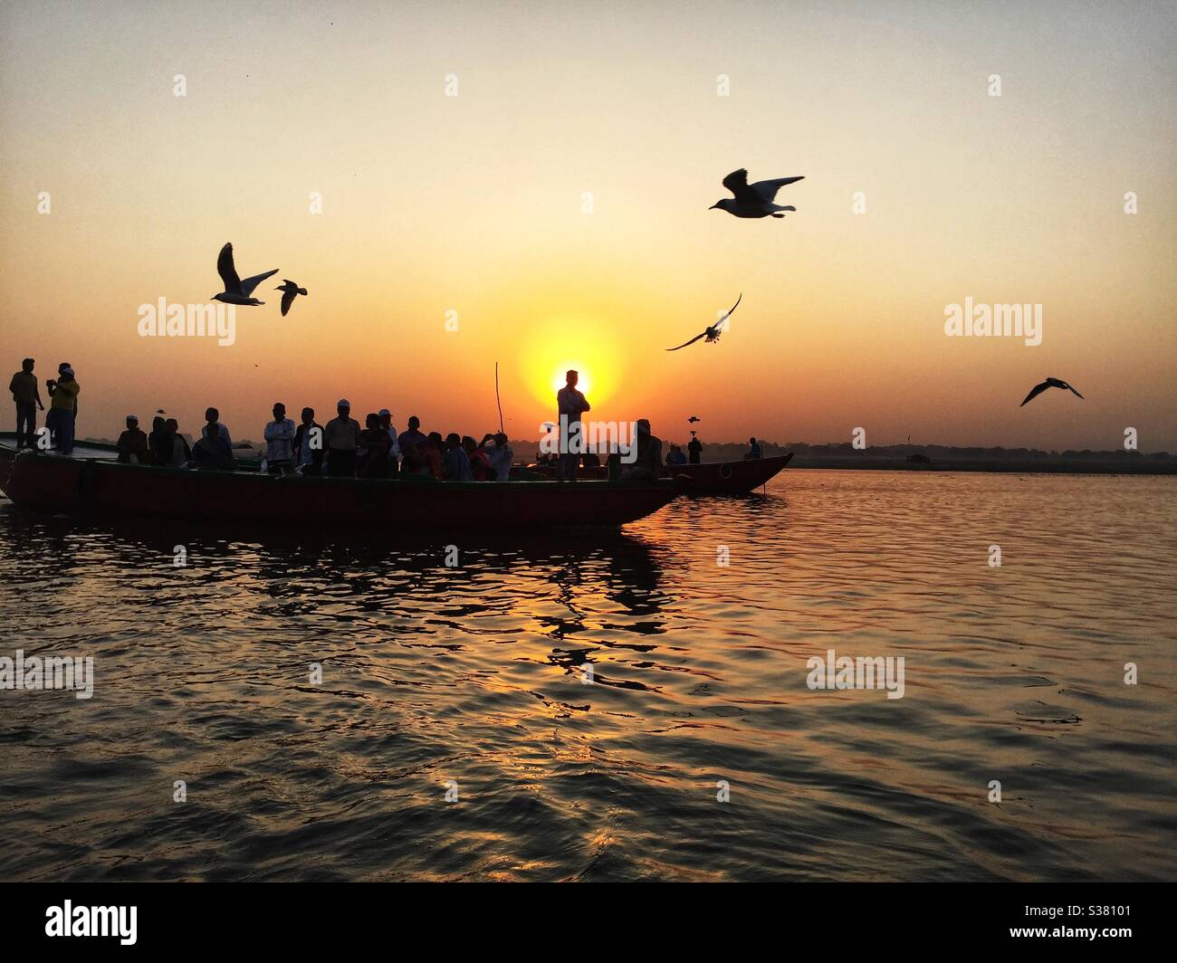 Boats on the river Ganges at sunrise in Varanasi, India - Smartphone Captured Stock Image