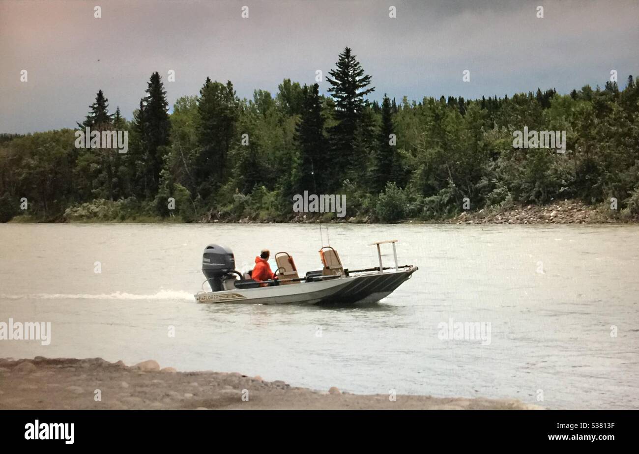 Going fishing,the Bow River,, two men, motorboat, Cochrane  launch, Alberta, Canada - Smartphone Captured Stock Image