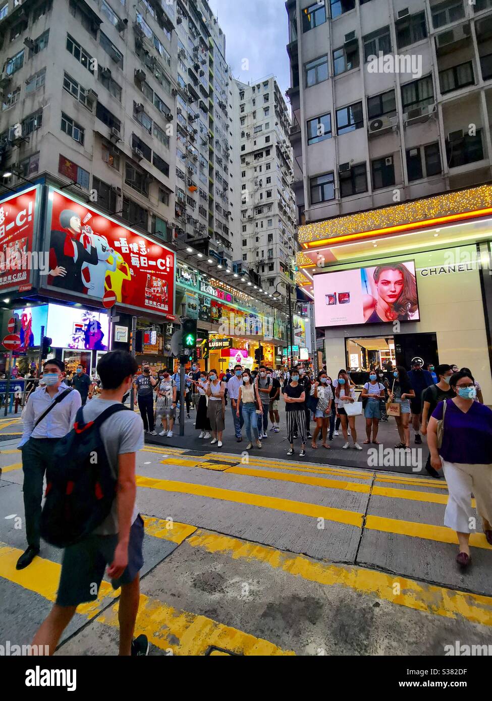Hongkongers wearing surgical masks during the third phase of the Coronavirus outbreak in July 2020. - Smartphone Captured Stock Image