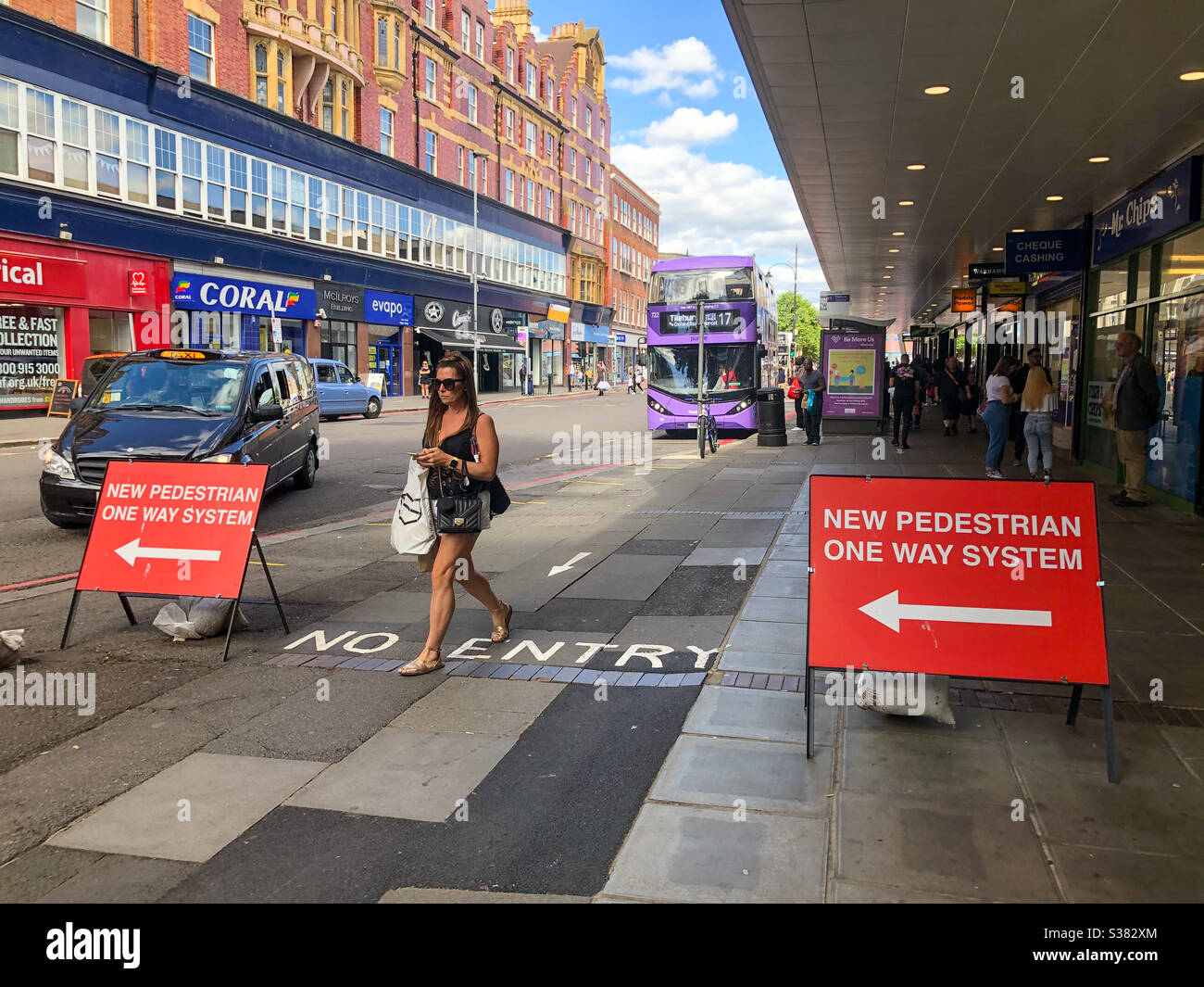 A one way system for pedestrians due to COVID-19 in Reading town centre in The UK. - Smartphone Captured Stock Image