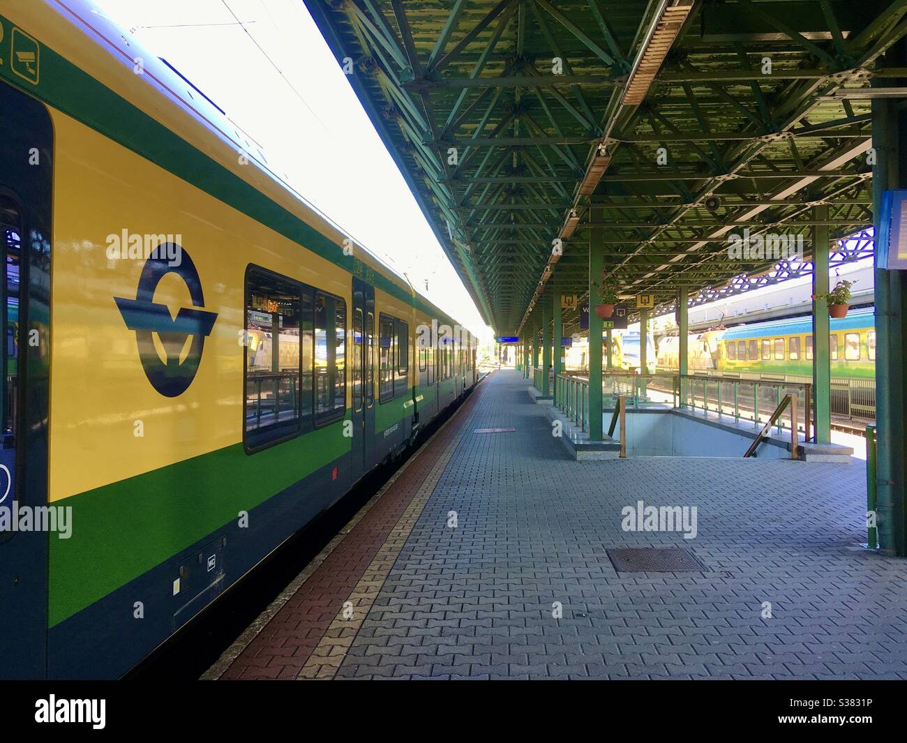 Railway station with GYSEV electric multiple unit train and GYSEV logo, Sopron, Hungary - Smartphone Captured Stock Image