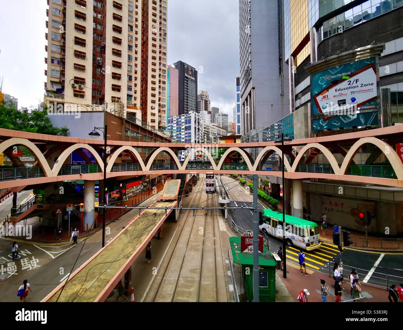 The circular footbridge in Causeway Bay above Yee Wo street . - Smartphone Captured Stock Image