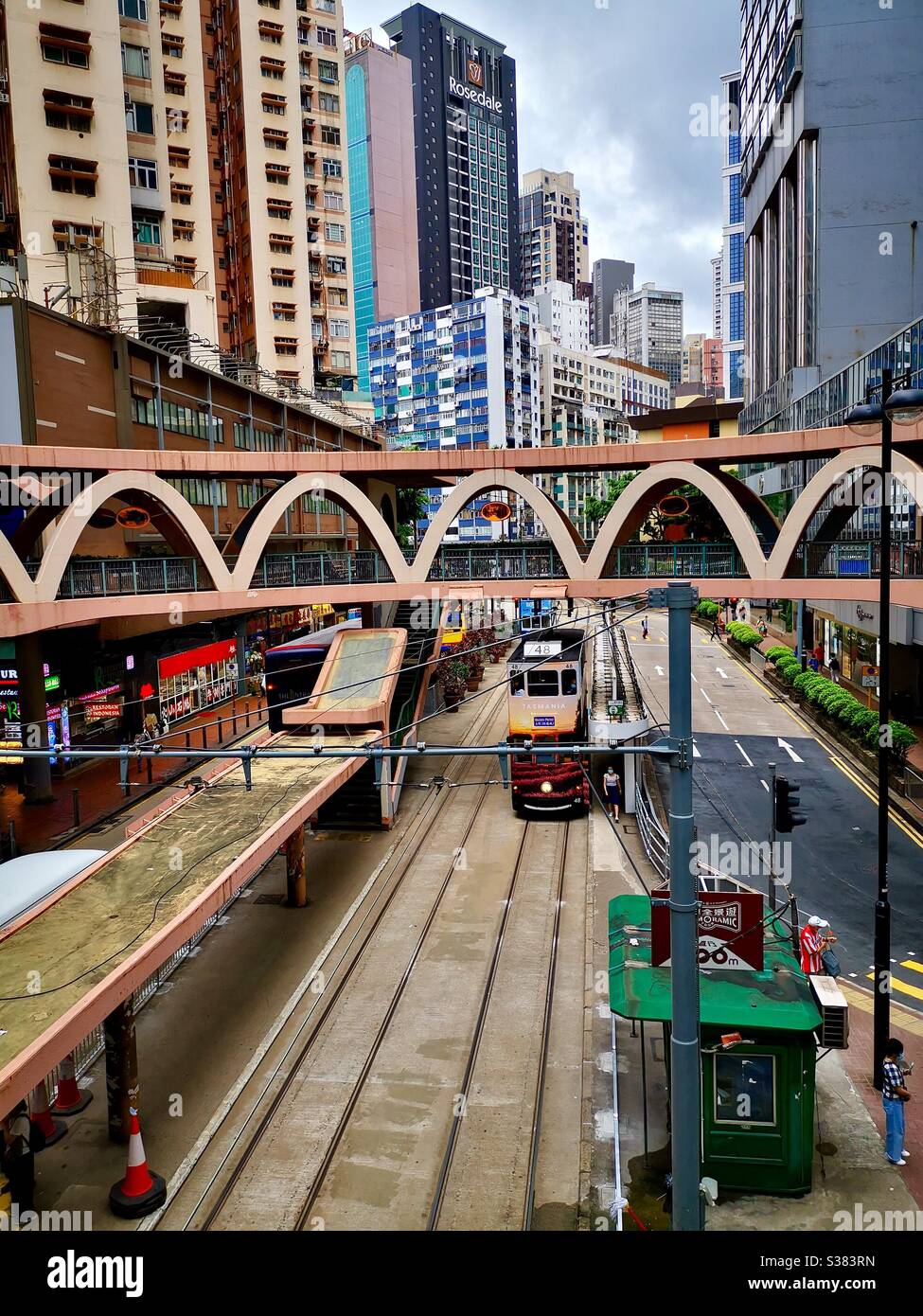 The circular footbridge in Causeway Bay above Yee Wo street . - Smartphone Captured Stock Image