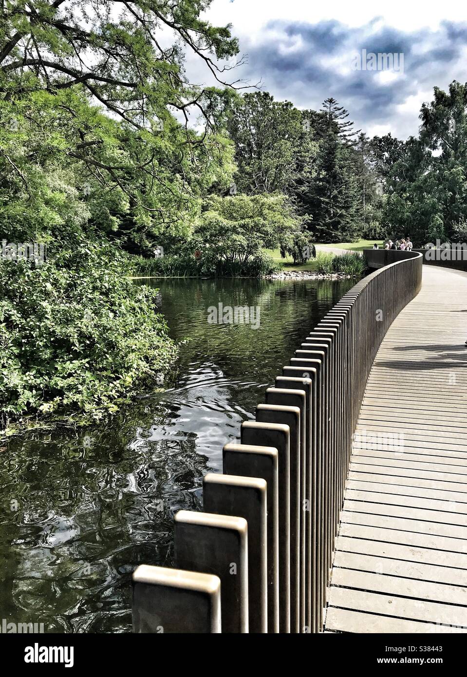 Sackler Crossing, A Black Granite bridge / walkway over the lake at Royal Botanic Kew Gardens - Smartphone Captured Stock Image