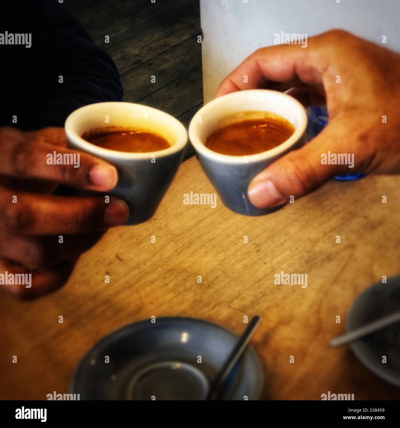 Enjoying coffee together - Smartphone Captured Stock Image