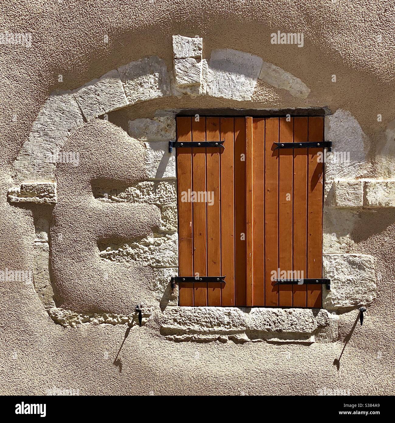 Modern window shutters in ancient uneven house wall - Bélâbre, Indre, France. - Smartphone Captured Stock Image