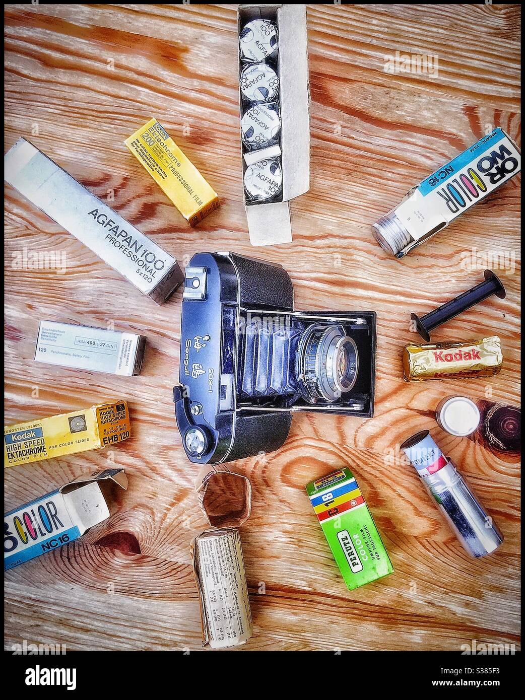 An old film camera with film canisters Stock Photo Alamy