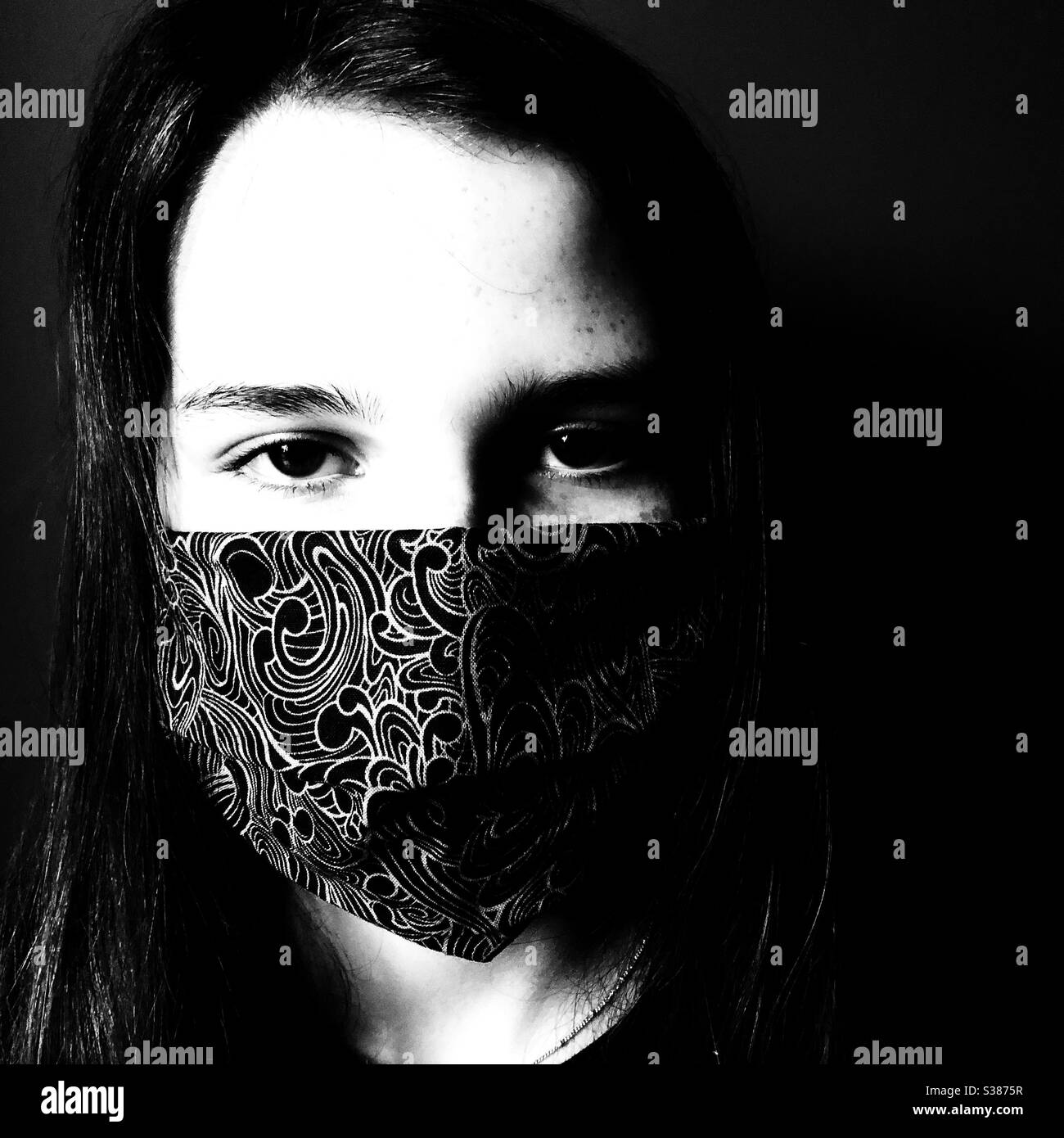 Teen girl wearing cloth face mask Stock Photo