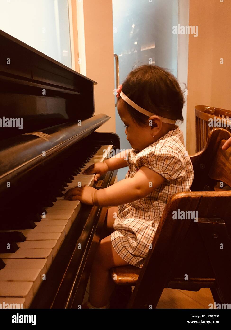 Baby playing piano Stock Photo Alamy