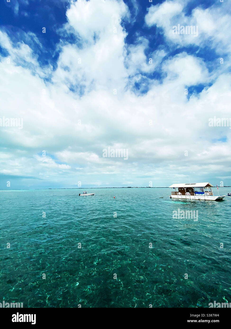 Tourist boats at Hol Chan Marine Reserve in Belize on March 11, 2020. - Smartphone Captured Stock Image