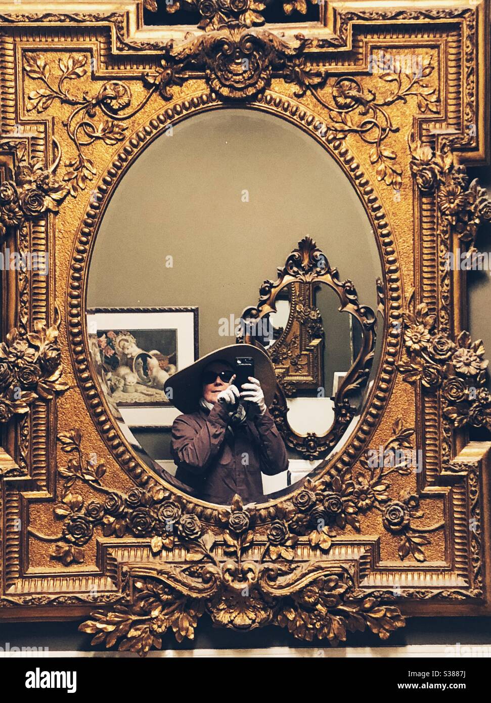 Selfie in Baroque style gilded mirror in bathroom of Olive Oatman Restaurant and Saloon - Smartphone Captured Stock Image
