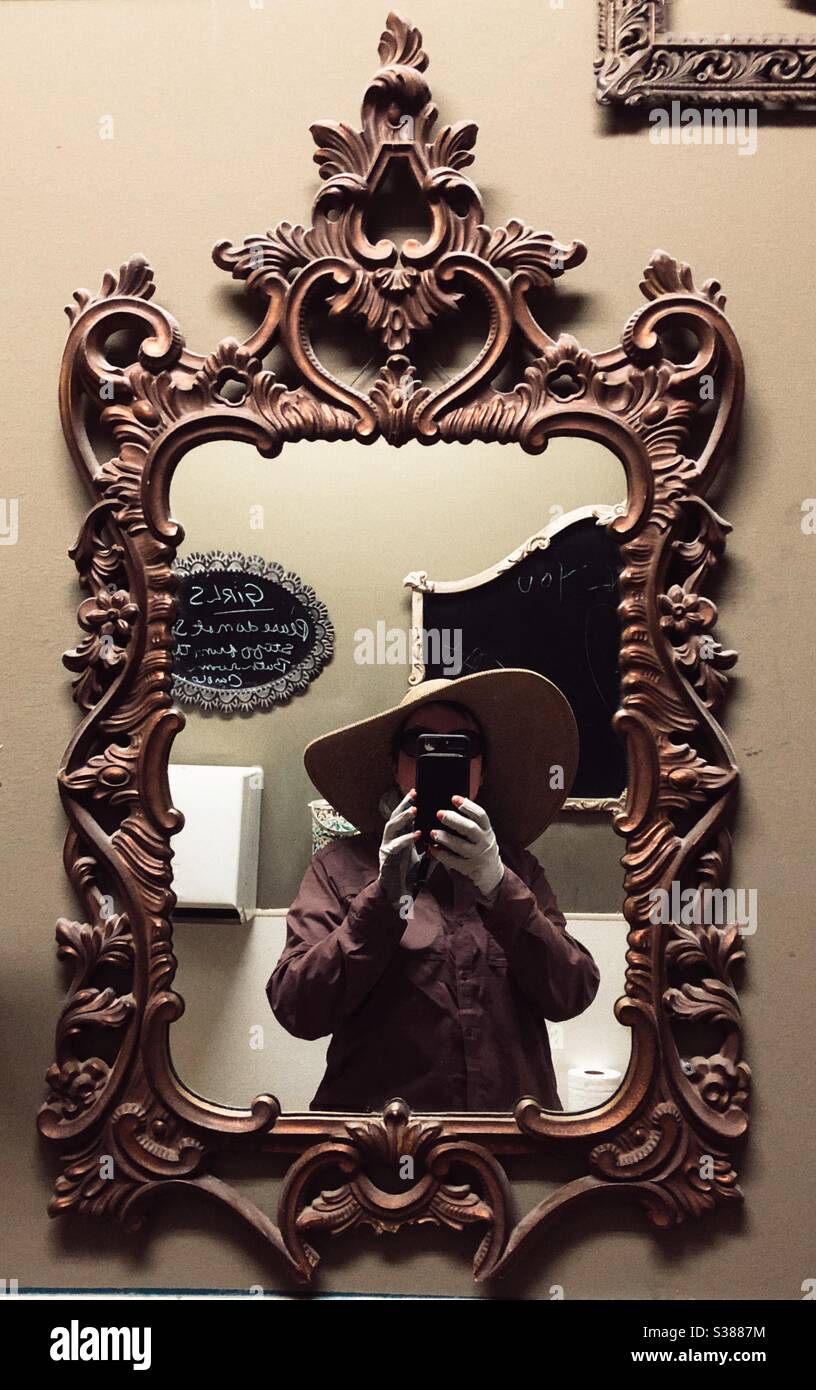 Selfie in Baroque style gilded mirror in bathroom of Olive Oatman Restaurant and Saloon - Smartphone Captured Stock Image