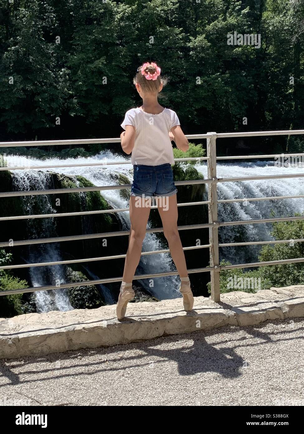 Ballerina on pointe shoes at Marmore waterfall, Italy. - Smartphone Captured Stock Image