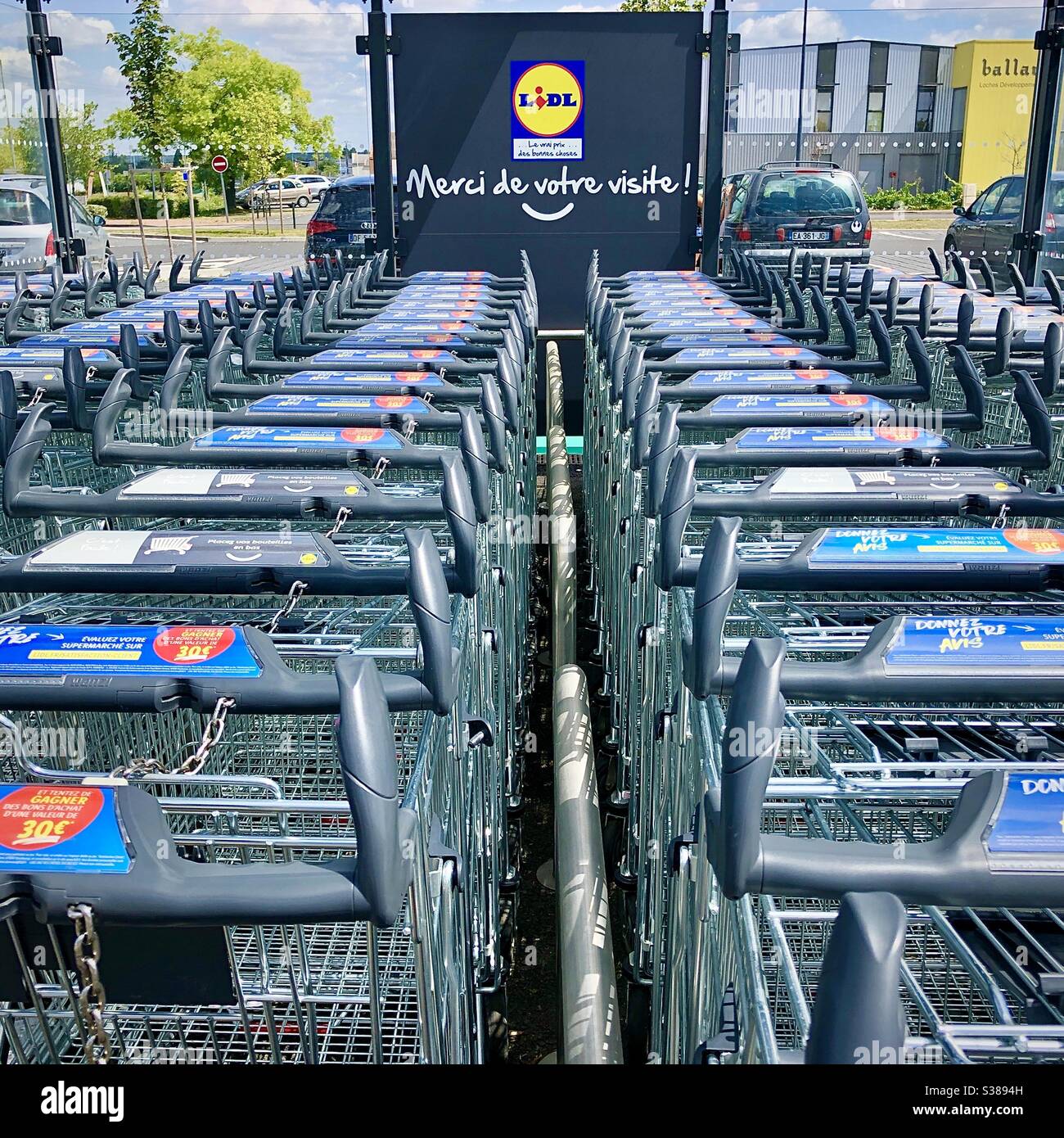 Rows of supermarket trolleys at French LIDL supermarket. - Smartphone Captured Stock Image