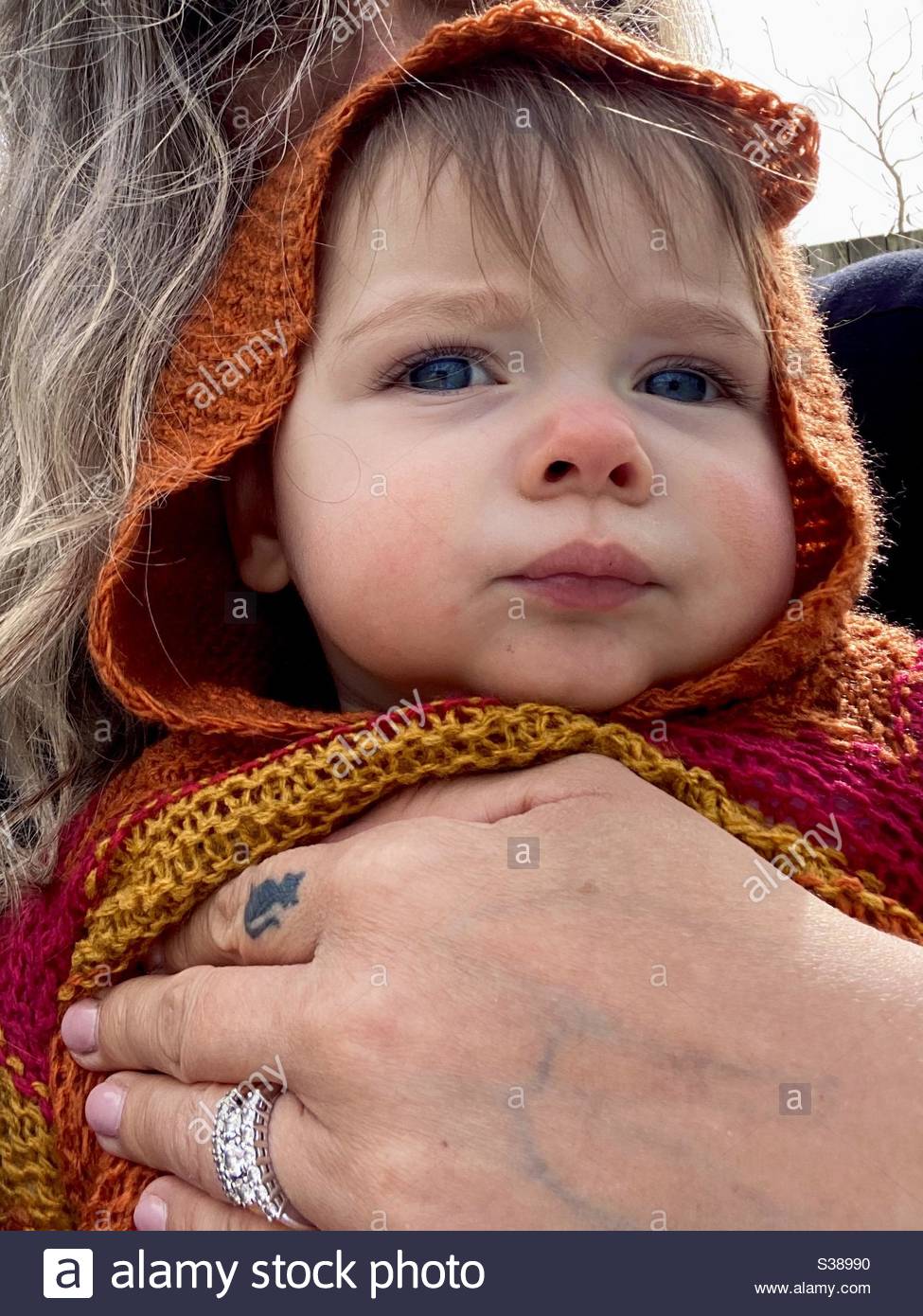 Cute Baby Girl With Blue Eyes Wearing Hood Stock Photo Alamy