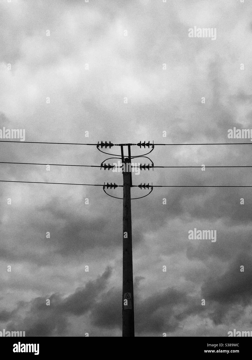 Overhead power line pole. - Smartphone Captured Stock Image