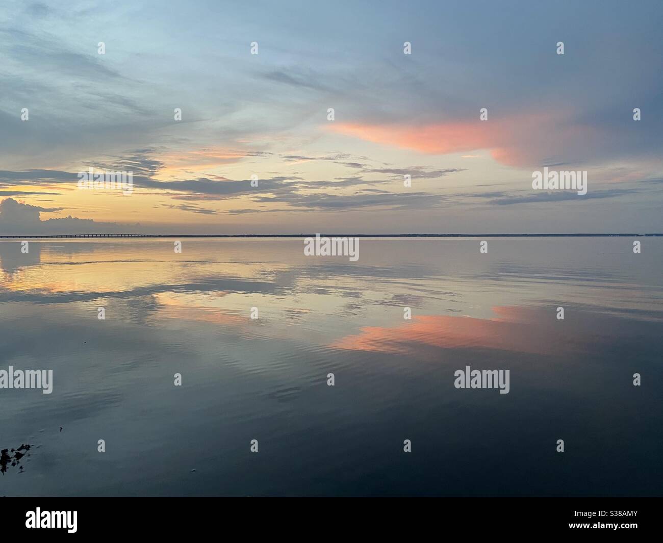 Beautiful sunset skies with colorful reflections over bay water Florida - Smartphone Captured Stock Image