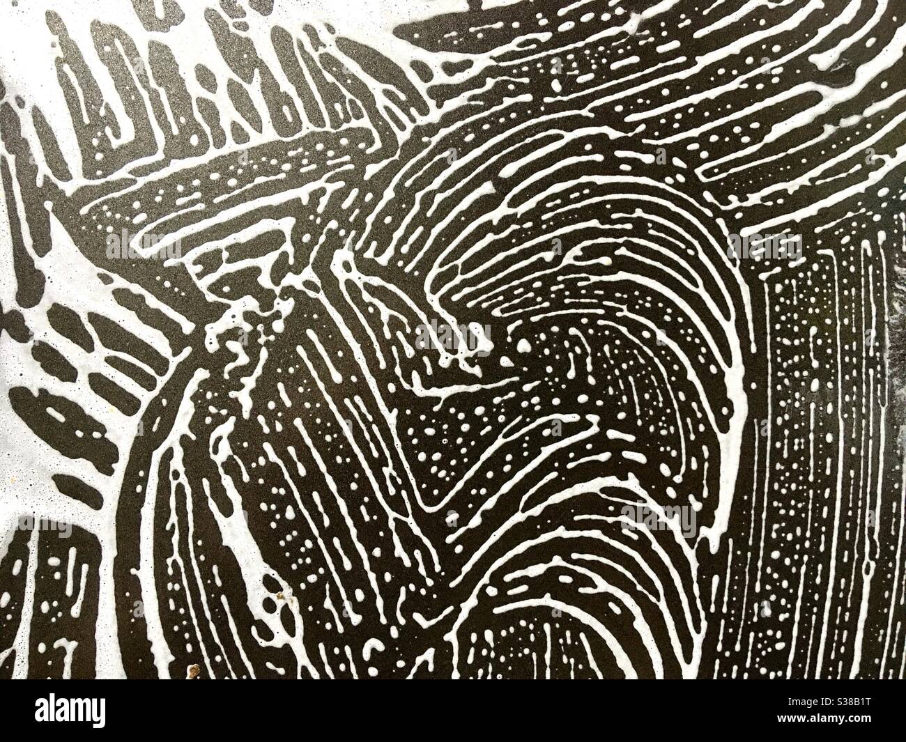 Abstract print of sponge on baking pan while doing the washing up - Smartphone Captured Stock Image